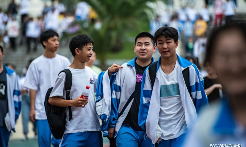 Examinees walk out of an exam site at a high school in Guiyang, the capital city of southwest China's Guizhou Province, June 8, 2021. Photo: Xinhua