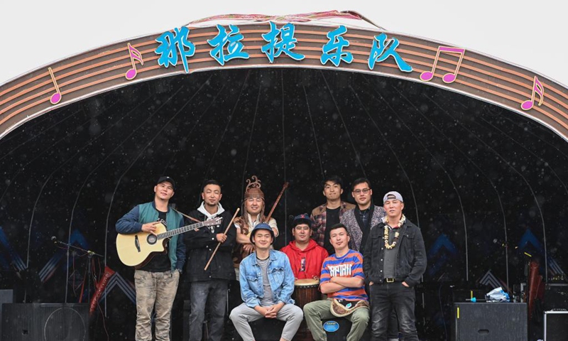 Members of Narat band pose for a group photo after a show at the Narat scenic spot in Xinyuan County of northwest China's Xinjiang Uygur Autonomous Region, June 4, 2021. Photo: Xinhua
