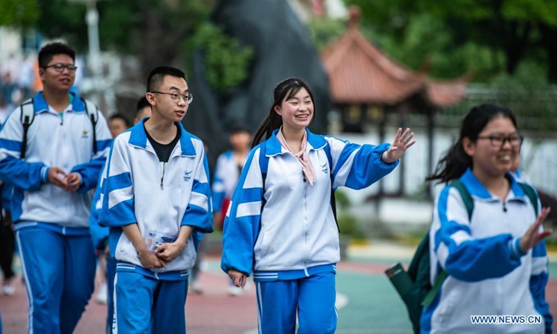 Examinees walk out of an exam site at a high school in Guiyang, the capital city of southwest China's Guizhou Province, June 8, 2021. Photo: Xinhua