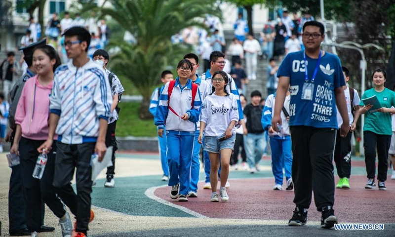 Examinees walk out of an exam site at a high school in Guiyang, the capital city of southwest China's Guizhou Province, June 8, 2021. Photo: Xinhua