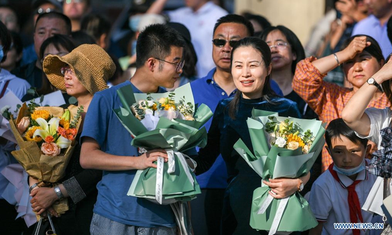 Parents wait outside an exam site at a high school in Hohhot, north China's Inner Mongolia Autonomous Region, June 8, 2021. Photo: Xinhua