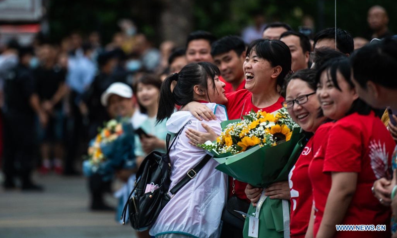 An examinee hugs her teacher at an exam site of a high school in Guiyang, the capital city of southwest China's Guizhou Province, June 8, 2021. Photo: Xinhua