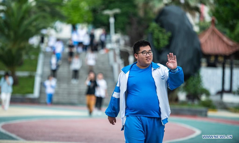 An examinee walks out of an exam site at a high school in Guiyang, the capital city of southwest China's Guizhou Province, June 8, 2021. Photo: Xinhua