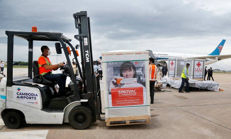 A worker transports a package of Chinese COVID-19 vaccines at the Phnom Penh International Airport in Phnom Penh, Cambodia, June 8, 2021. Photo: Xinhua