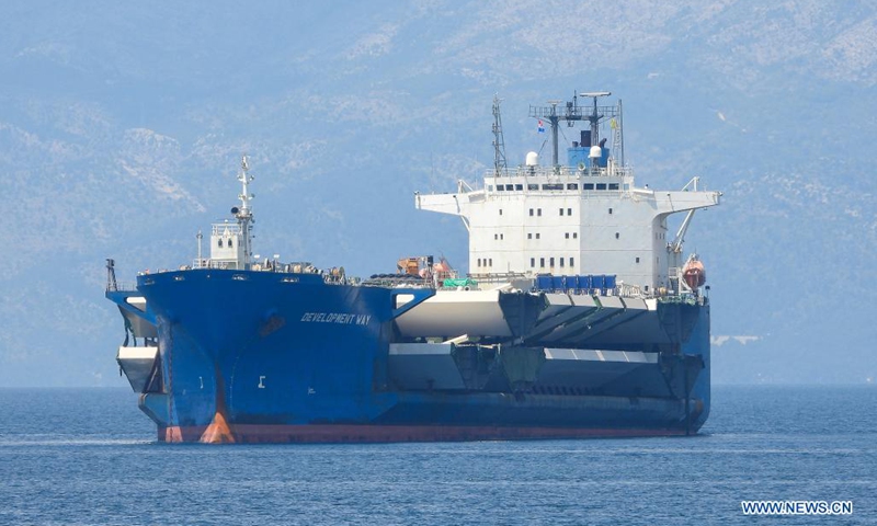 A cargo ship carrying the final batch of steel box girders for the construction of the Peljesac Bridge arrive at the Port of Ploce, Croatia, June 8, 2021. The construction of the Peljesac Bridge, the biggest infrastructure project in Croatia, will be completed in June 2022.(Photo: Xinhua)