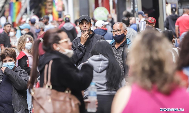 People walk on the street amid COVID-19 outbreak in Sao Paulo, Brazil on June 8, 2021.(Photo: Xinhua)
