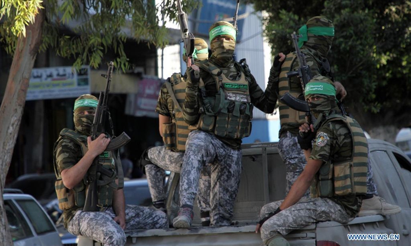 Members of the Ezz al-Din al-Qassam brigades, the military wing of the Palestinian Hamas movement, take part in a military parade at Tuffah neighborhood in Gaza City, on June 7, 2021.(Photo: Xinhua)