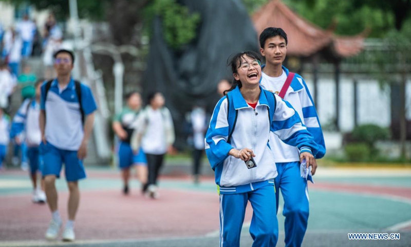 Examinees walk out of an exam site at a high school in Guiyang, the capital city of southwest China's Guizhou Province, June 8, 2021. Photo: Xinhua
