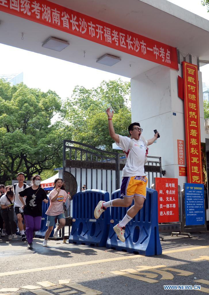 Examinees run out of an exam site at a middle school in Changsha, capital of central China's Hunan Province, June 9, 2021. China's annual college entrance exam concluded on Tuesday in some parts of the country. Photo: Xinhua
