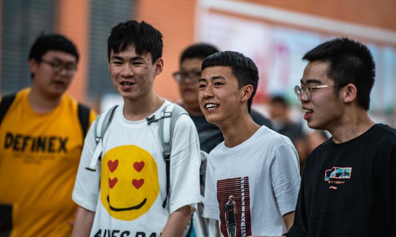 Examinees walk out of an exam site at a high school in Guiyang, the capital city of southwest China's Guizhou Province, June 8, 2021. Photo: Xinhua