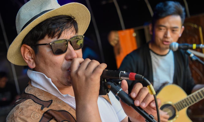 Members of Narat band perform at the Narat scenery spot in Xinyuan County of northwest China's Xinjiang Uygur Autonomous Region, June 3, 2021. Photo: Xinhua
