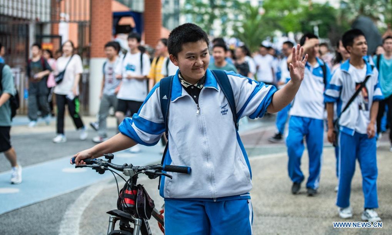 Examinees walk out of an exam site at a high school in Guiyang, the capital city of southwest China's Guizhou Province, June 8, 2021. Photo: Xinhua