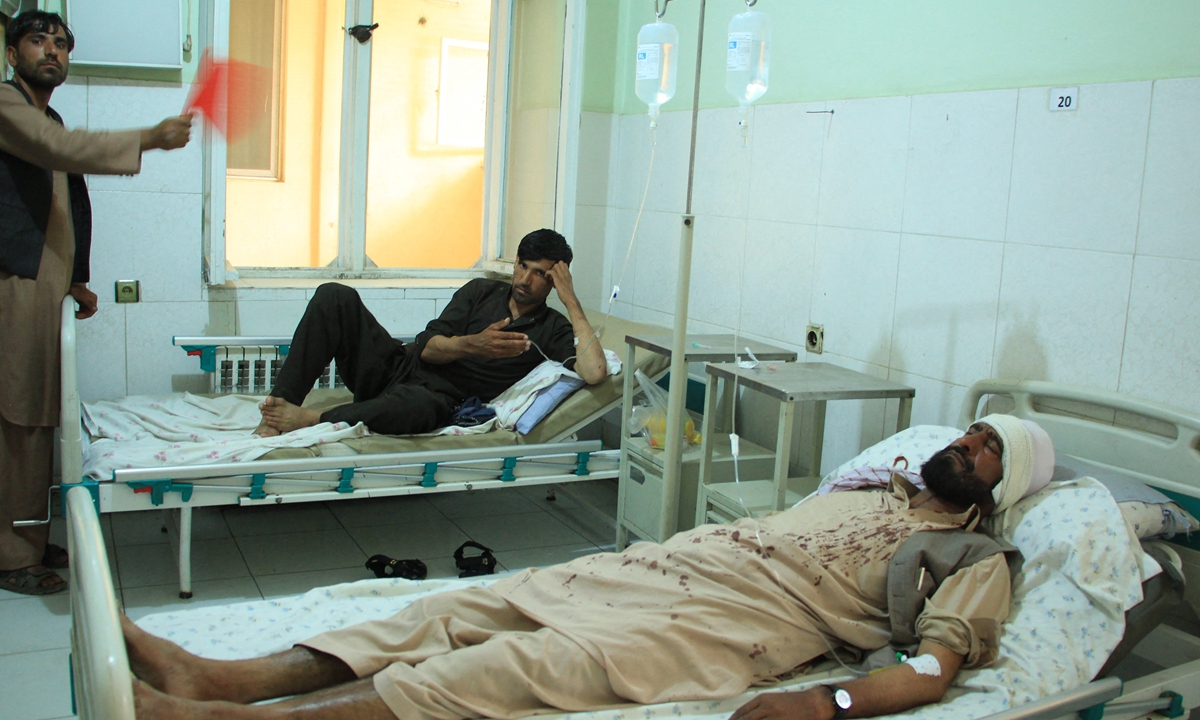 Wounded people receive treatments at a hospital following an attack by gunmen who shot 10 people working for the HALO Trust mine-clearing organization in Baghlan Province, Afghanistan on Wednesday. A government spokesperson said the Taliban was responsible, although the group denied it. Photo: AFP