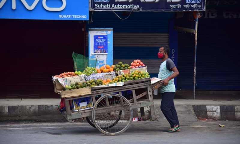 A vendor walks in a closed market during a lockdown imposed to curb the spread of the COVID-19 in Nagaon district of Assam, India, June 8, 2021.Photo: Xinhua