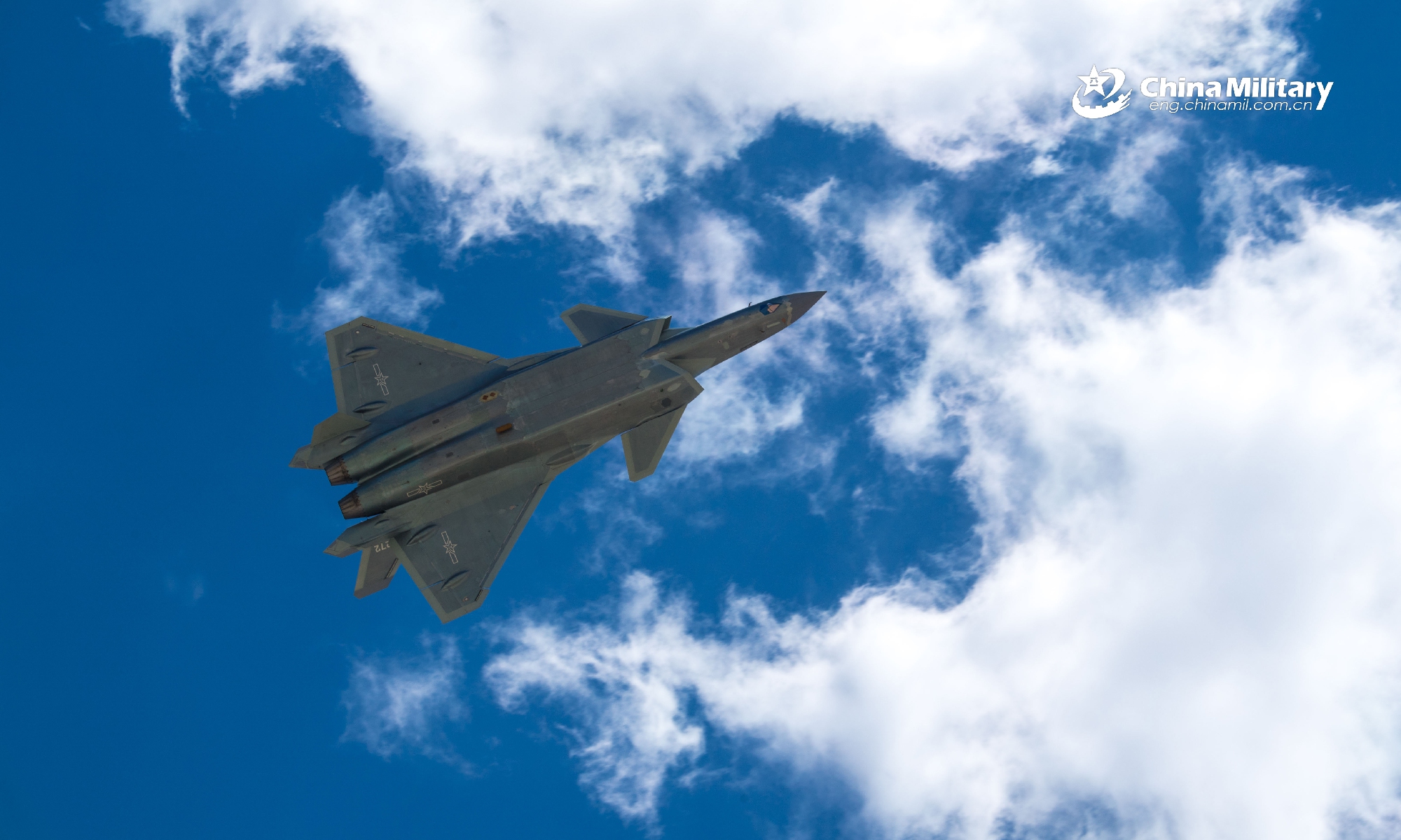 The file photo shows a J-20 stealth fighter jet attached to the Chinese PLA Air Force flies through the clouds overhead during a flight training exercise. (eng.chinamil.com.cn/Photo by Yang Jun)
