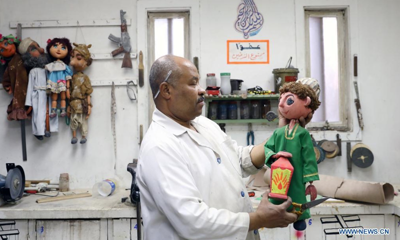 An Egyptian artist creates a puppet for the puppet play Journey Through Beautiful Time at Cairo Puppet Theater in Cairo, Egypt, on June 5, 2021. Photo: Xinhua