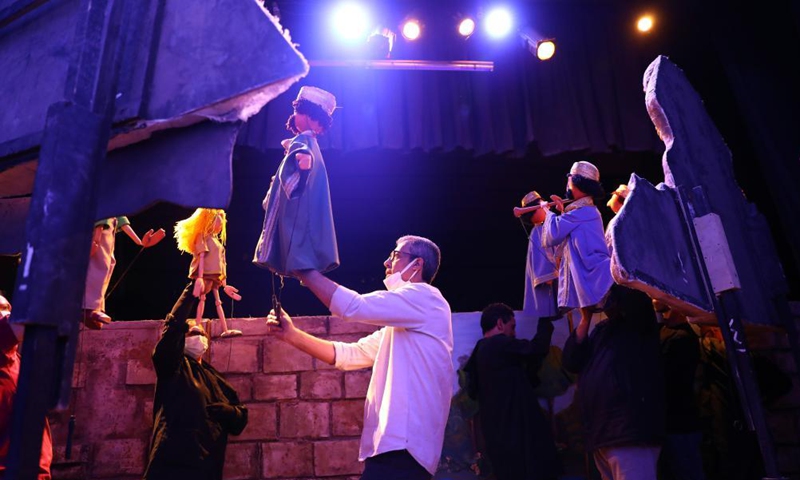 Egyptian artists perform during the puppet play Journey Through Beautiful Time at Cairo Puppet Theater in Cairo, Egypt, on June 5, 2021. Photo: Xinhua