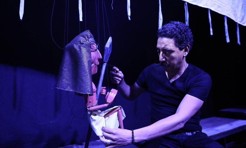 An Egyptian artist prepares at the backstage during the puppet play Journey Through Beautiful Time at Cairo Puppet Theater in Cairo, Egypt, on June 5, 2021. Photo: Xinhua