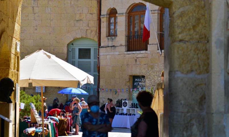 People visit the artisan market in Vittoriosa, Malta, on June 13, 2021. The market offers a wide array of products from local makers, designers, artisans and artists.(Photo: Xinhua)