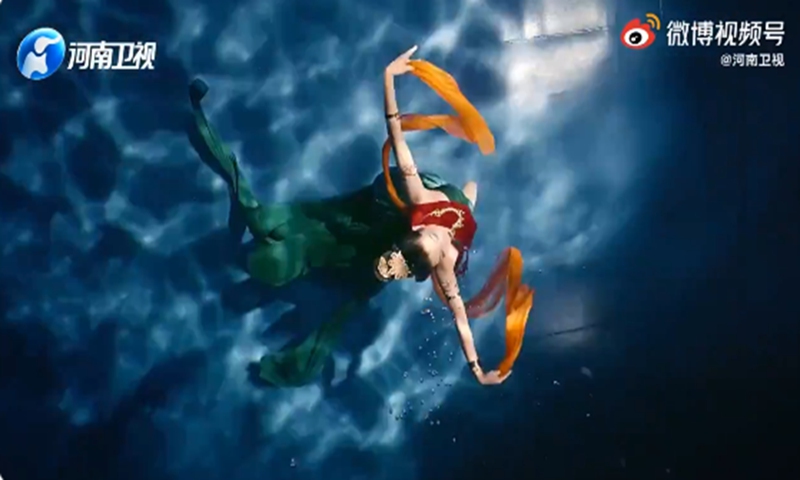Woman performs classical dancing in the water. Her beautiful moves and flowing dress draw to mind Luoshen, a mythical Chinese water goddess. Photo: screenshot on Sina Weibo