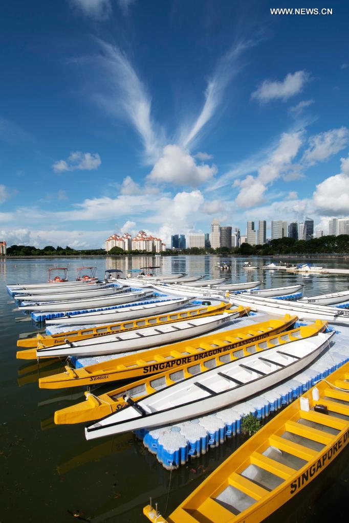 Empty dragon boats are berthed on a floating platform as part of the restrictive measures amid the COVID-19 pandemic, instead of racing during the traditional Dragon Boat Festival, in Singapore's Kallang Basin, June 14, 2021. Photo: VCG