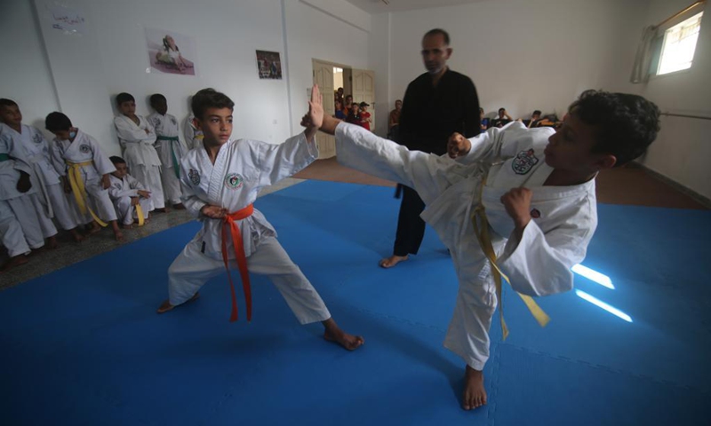 Palestinian children take part in a karate class at Rafah Youth Club in the southern Gaza Strip city of Rafah, on June 13, 2021. Palestinian Minister of Health Mai al-Kaila announced on Saturday that Palestine has recently witnessed a collective recovery from COVID-19. Photo: Xinhua