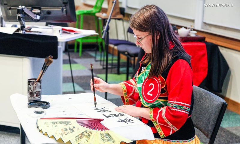 A contestant writes Chinese calligraphy during the 2021 Chinese Bridge Chinese Proficiency Competition in Christchurch, New Zealand, June 13, 2021. Photo: VCG