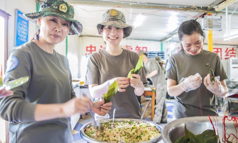 Members of a medical detachment of China's 24th peacekeeping team to the Democratic Republic of Congo (DRC) make rice dumplings on the occasion of the traditional Dragon Boat Festival in Bukavu, the DRC, June 14, 2021.(Photo: Xinhua)