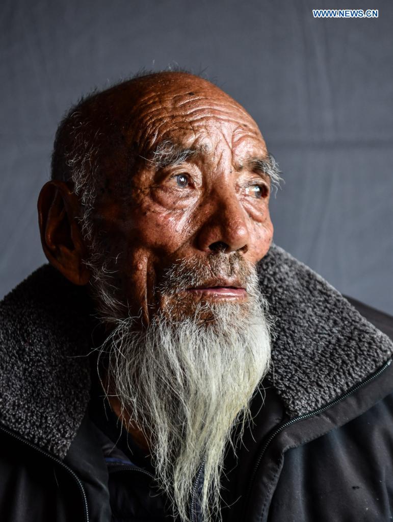 Photo taken on April 25, 2021 shows a portrait of Tobgye in Bomdoi Township, Dagze District of Lhasa, southwest China's Tibet Autonomous Region. Tobgye, 84, was once a serf and lived under cruel feudal serfdom before the democratic reform in Tibet in 1959.Photo: Xinhua 