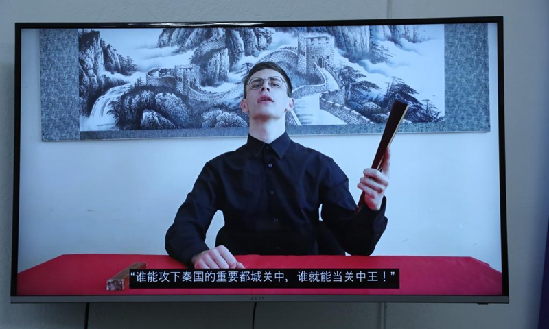 A contestant performs Pingshu (storytelling) via video link during a contest of the 20th Chinese Bridge, in Ukraine, June 13, 2021. The Ukrainian national qualification contest of the 20th Chinese Bridge, an annual worldwide Chinese competition for international students, was held online on Sunday amid the COVID-19 pandemic.Photo: Xinhua 