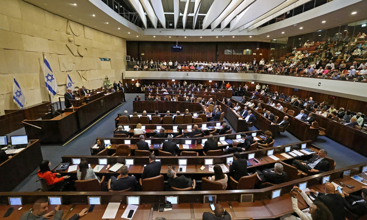 Israel's former prime minister Benjamin Netanyahu addresses lawmakers during a special session to vote on a new government at the Knesset in Jerusalem on Sunday. Photo: AFP