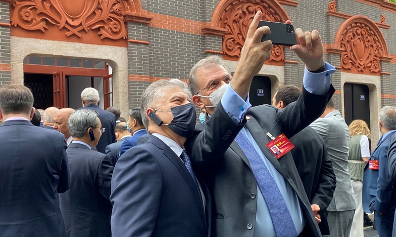 Diplomats take a selfie in front of the site of the First National Congress of the CPC on Wednesday in Shanghai. Photo: Global Times