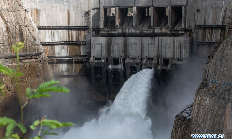 Photo taken on June 29, 2020 shows water gushing out from a sluiceway of the Wudongde Hydropower Station on the border of Sichuan and Yunnan provinces in southwest China. The first group of electricity-generation units at the Wudongde Hydropower Station was put into use on Monday.(Photo: Xinhua)