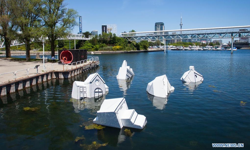The art installation Over Floe is seen at Ontario Place in Toronto, Canada, on June 15, 2021. Made of some waste construction materials by artist John Notten, the public art project Over Floe aims to illustrate the harm of human-caused global warming as ice sheets melt and oceans expand, threatening the way of life around the shorelines of the world.(Photo: Xinhua)