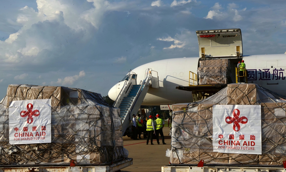 Lao workers load Chinese-donated anti-COVID-19 medical supplies at Wattay International Airport in Vientiane, Laos, on May 10, 2020. Photo: Xinhua