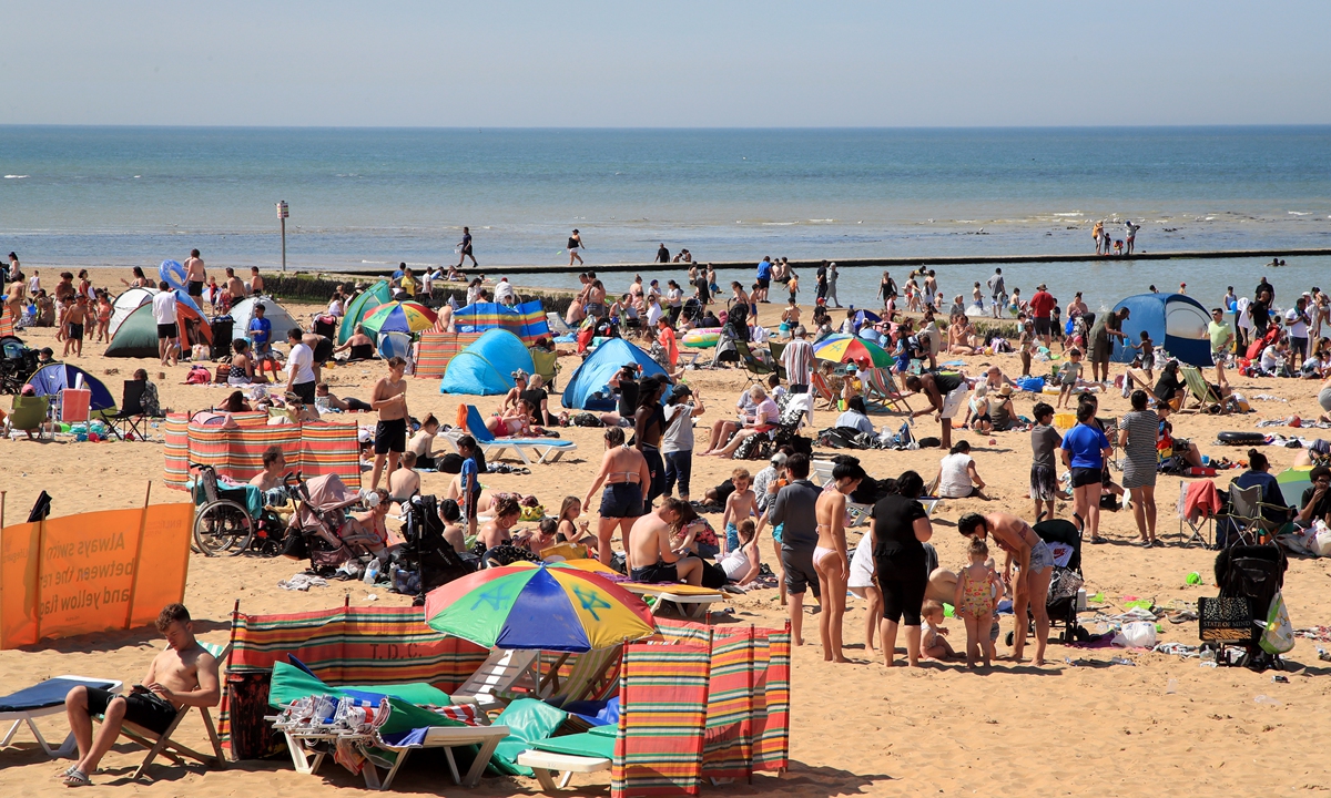 People enjoy the beach in Margate, England on June 1. Photo: VCG