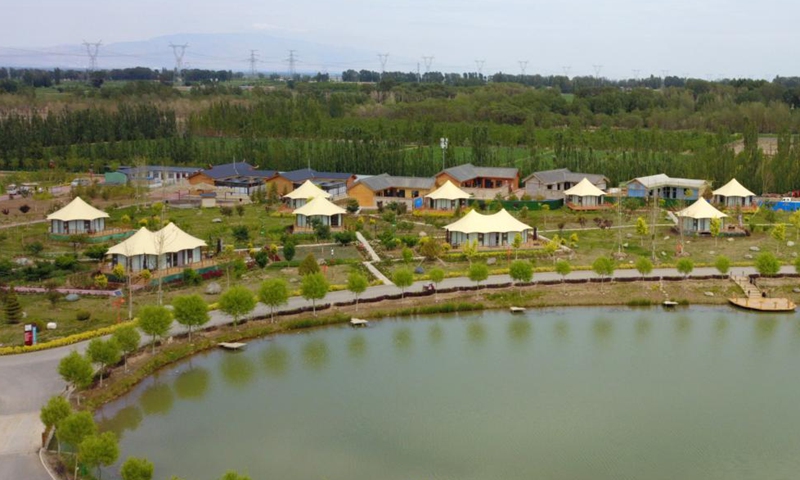 Aerial photo taken on June 16, 2021 shows a view of a river system in Linze County, Zhangye City, northwest China's Gansu Province. Linze County is located in the southern edge of Badain Jaran Desert, the third largest desert in China, with Heihe River, China's second largest inland river, passing through the county.   Photo: Xinhua