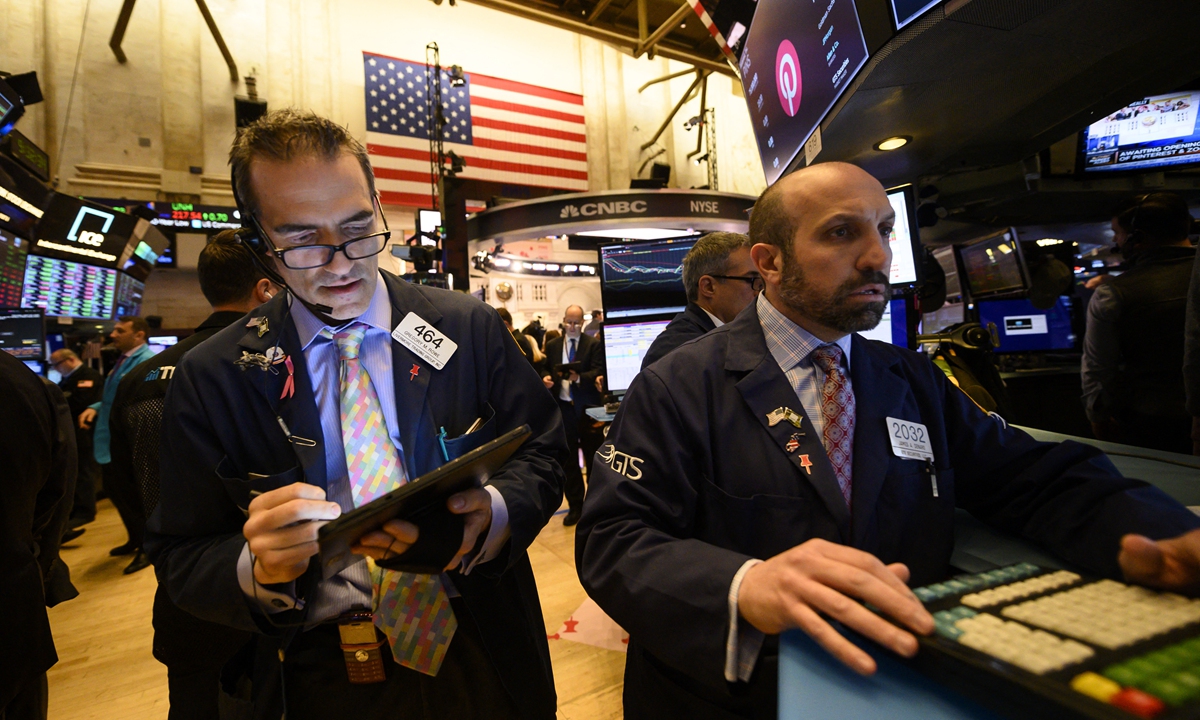 Traders work at the New York Stock Exchange on April 18, 2019 in New York City. Photo: AFP
