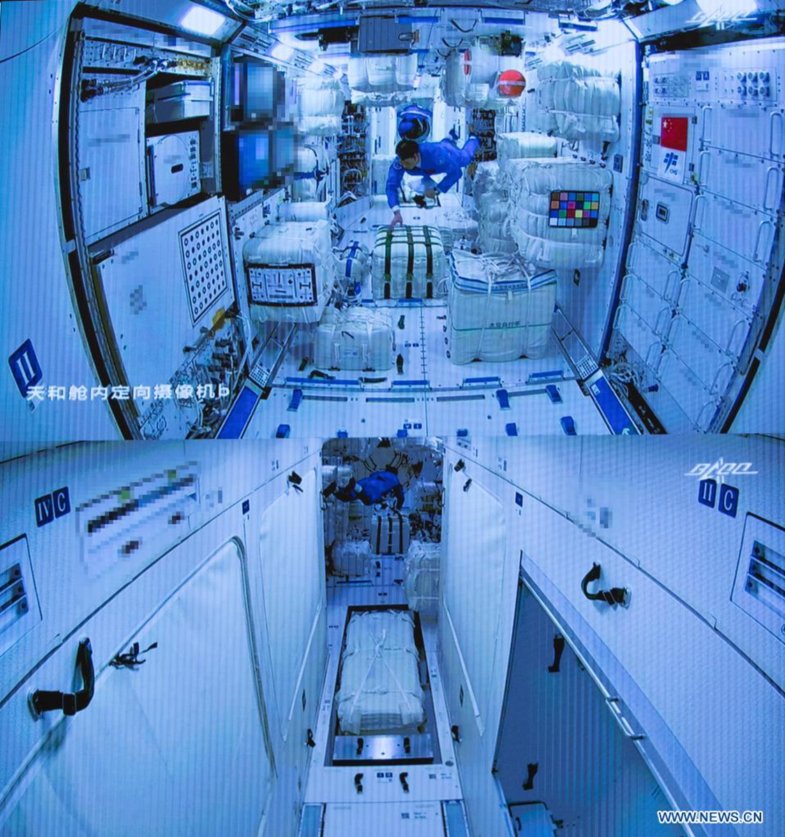 Screen image captured at Beijing Aerospace Control Center in Beijing, capital of China, June 17, 2021 shows three Chinese astronauts onboard the Shenzhou-12 spaceship entering the space station core module Tianhe.