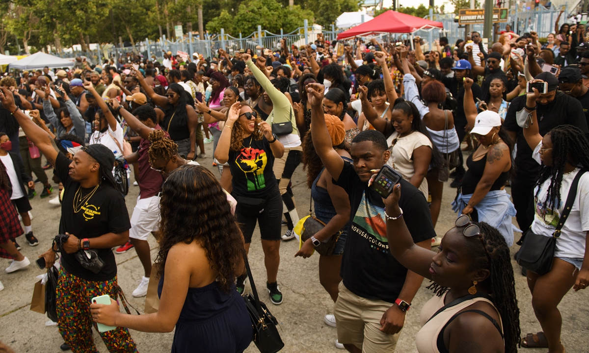 People dance during the Leimert Park Rising Juneteenth celebration on Saturday in Los Angeles, California. Photo: AFP