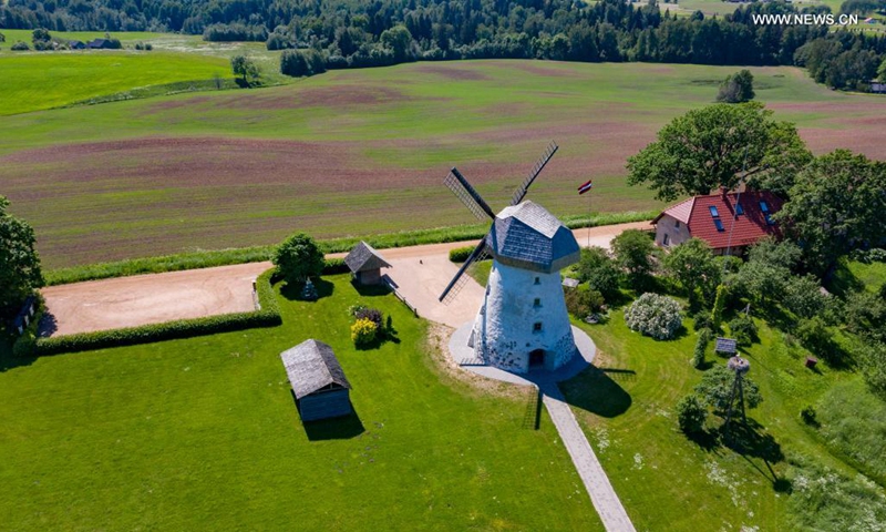 Photo taken on June 17, 2021 shows the summer scenery of a windmill in Cesis, Latvia.(Photo: Xinhua)