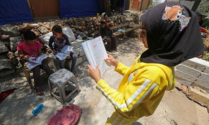 Syrian refugee children study in the Ketermaya refugee camp outside Beirut, capital of Lebanon, on June 19, 2021. (Photo: Xinhua)