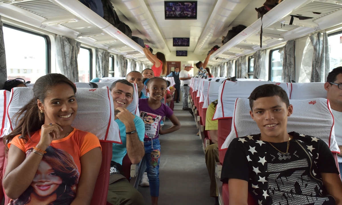 Passengers sit on-board a Chinese-designed and manufactured train in Havana on July 13, 2019. It was the first time since 1975 that Cuba has purchased new railway coaches, which has provided an important underpinning for the modernization of Cuba's railway system in recent years. Photo: Xinhua