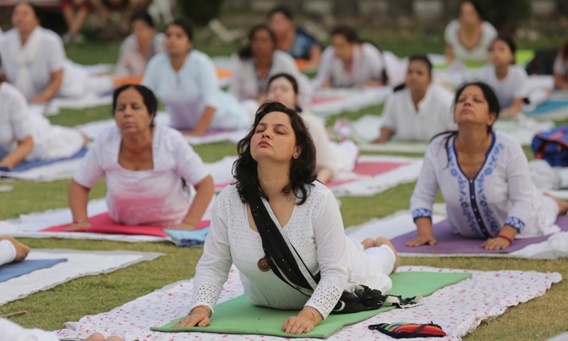 people perform yoga in bhopal, capital of indias madhya pradesh