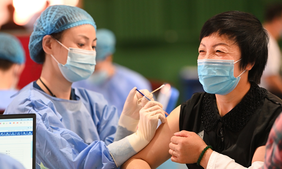 A nurse in Hohhot, Inner Mongolia Autonomous Region injects a women with COVID-19 vaccine. China has administered more than
1.01 billion doses as of Saturday, according to data released by the National Health Commission on Sunday. Photo: cnsphoto