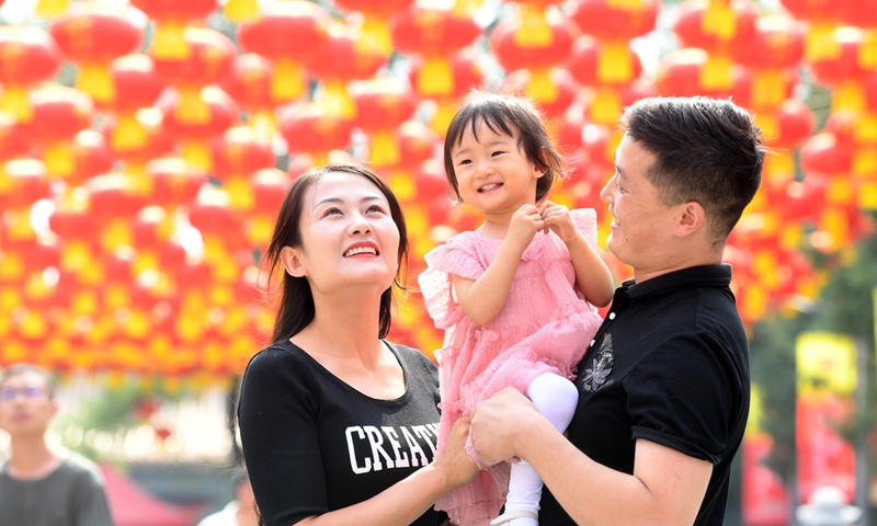 Tourists visit Badachu Park decorated with red lanterns in Beijing, China, October 2, 2019. (Photo: Xinhua)