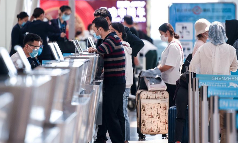 Passengers check in at Shenzhen Airport in Shenzhen, south China's Guangdong Province, Feb. 27, 2020. Number of flights at Shenzhen Airport has been increasing as production resumes across China. (Photo:Xinhua) 