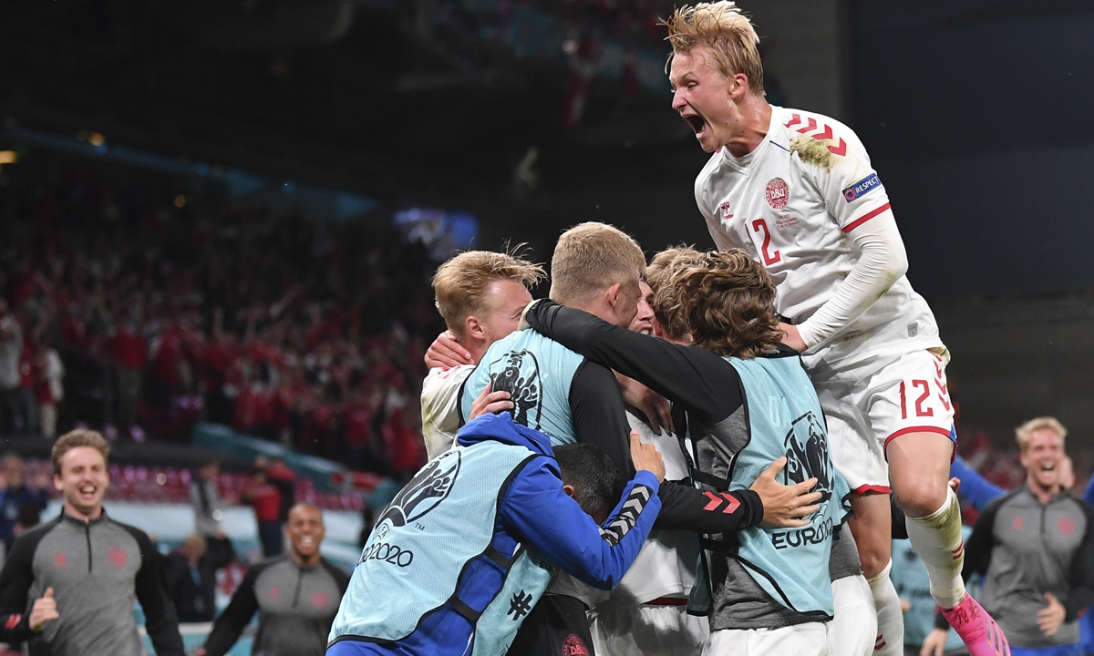 Players of Denmark celebrate during their match against Russia on Monday in Copenhagen, Denmark. Photos: VCG