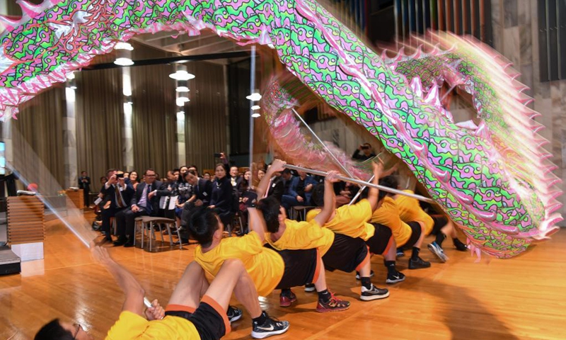 Performers from Dragon Dance Troupe of Wellington Chinese Sports and Cultural Centre stage a dragon dance during the Parliamentary Chinese Dragon Boat Festival Celebration at Wellington, New Zealand, June 21, 2021. The parliamentary celebration on China's traditional Dragon Boat Festival held in New Zealand has been expected to boost the understandings and cultural exchanges between the two countries.(Photo: Xinhua)