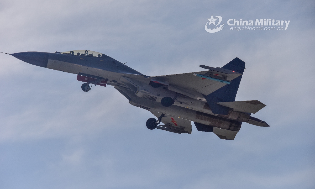 A fighter jet attached to an aviation brigade of the air force under the PLA Western Theater Command takes off from the runway during a flight training exercise on June 10, 2021. (eng.chinamil.com.cn/Photo by Cao Yukun)